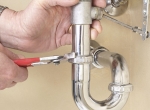 Plumber Fixing Sink Drain